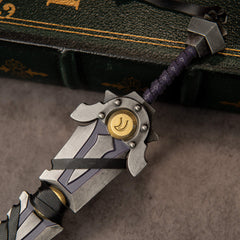 Armageddon replica — riveted round guard with a gold medallion and spiral-wrapped violet grip.
