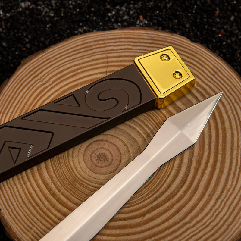 Biggoron's Sword replica — blade tip and cast edge close-up on wood.