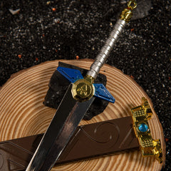 Biggoron's Sword replica — sword and scabbard crossed on a cut log slice.
