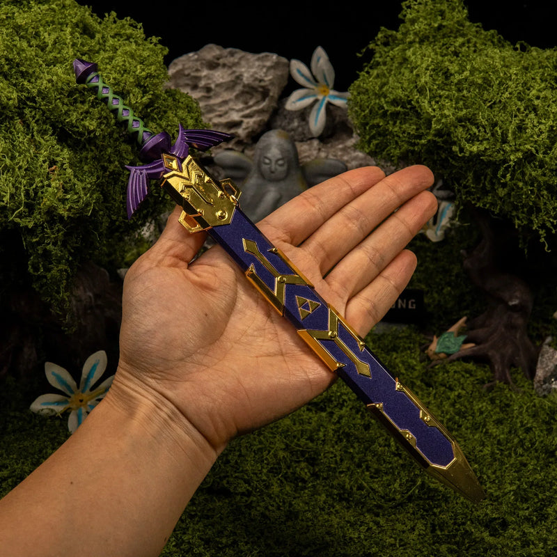 Master Sword replica (28cm die-cast zinc alloy sword) — held in hand for scale.