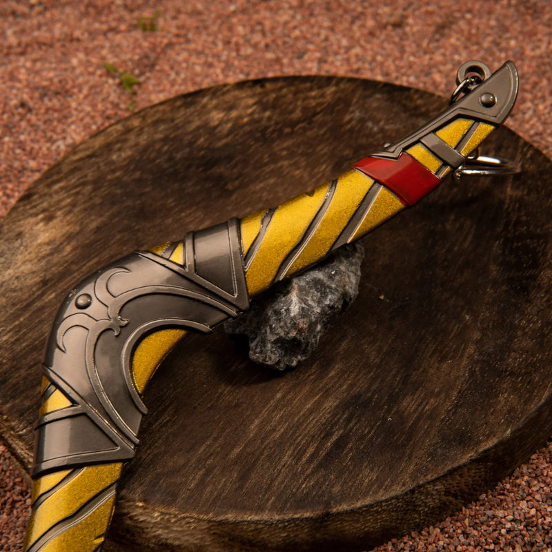 Boomerang replica — grip end and clip ring detail close-up on a wood stump.