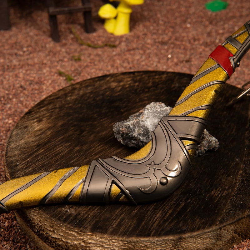 Boomerang replica — curved body and yellow stripe detail close-up on a wood stump.