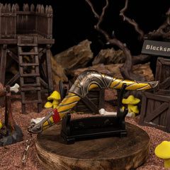 Boomerang replica — displayed on the small stand amid the camp scenery.