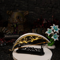 The Zelda Bow of Light miniature and Light Arrow displayed horizontally on a large black rack, set in front of the terrifying multi-eyed Calamity Ganon Malice diorama.