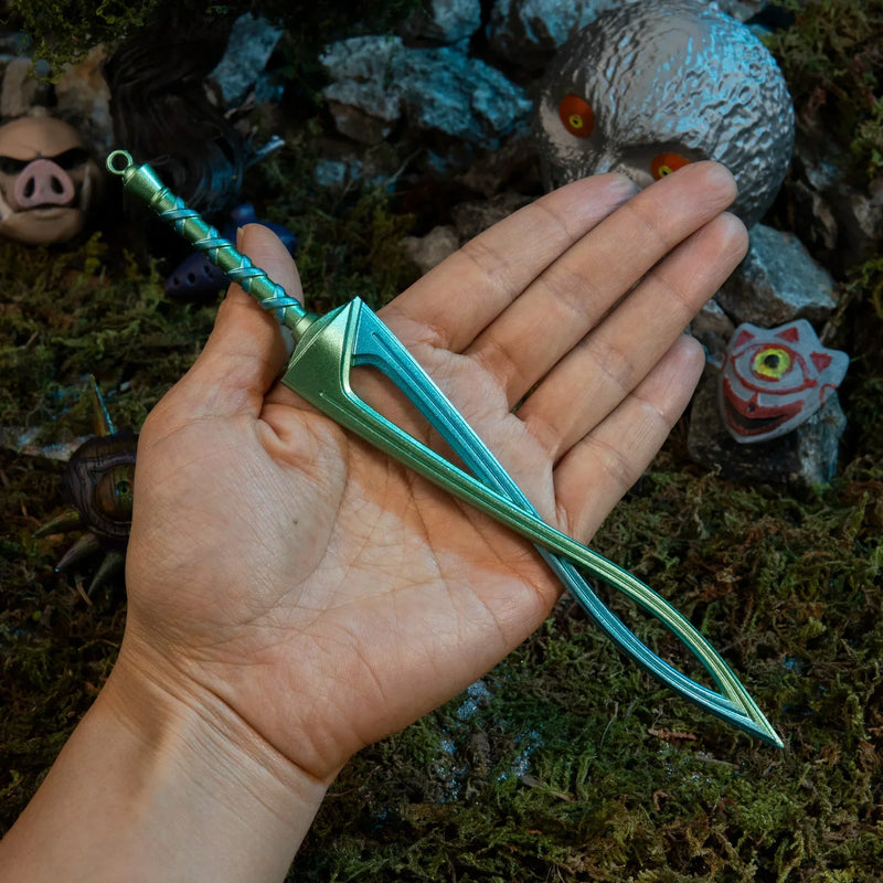 Fierce Deity Sword replica (21cm die-cast zinc alloy sword) — held in hand for scale.