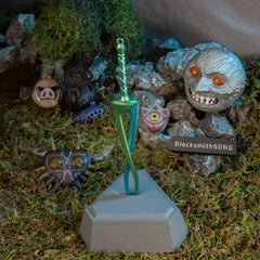 Fierce Deity Sword replica — displayed on the vertical stand, angled view of the triangular base.