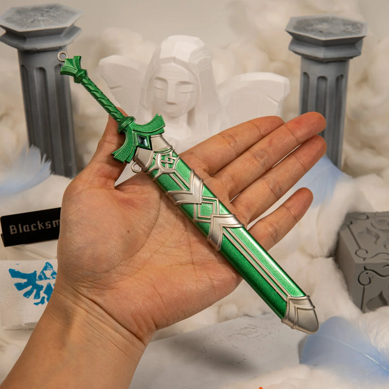 Goddess Sword replica (21cm die-cast zinc alloy sword) — held in hand for scale.