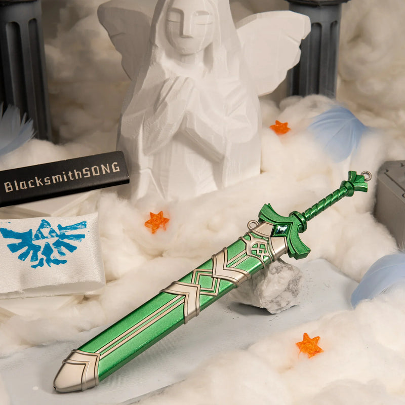 Goddess Sword replica — alternate angle in the handcrafted cloud diorama with a winged stone figure in the background.