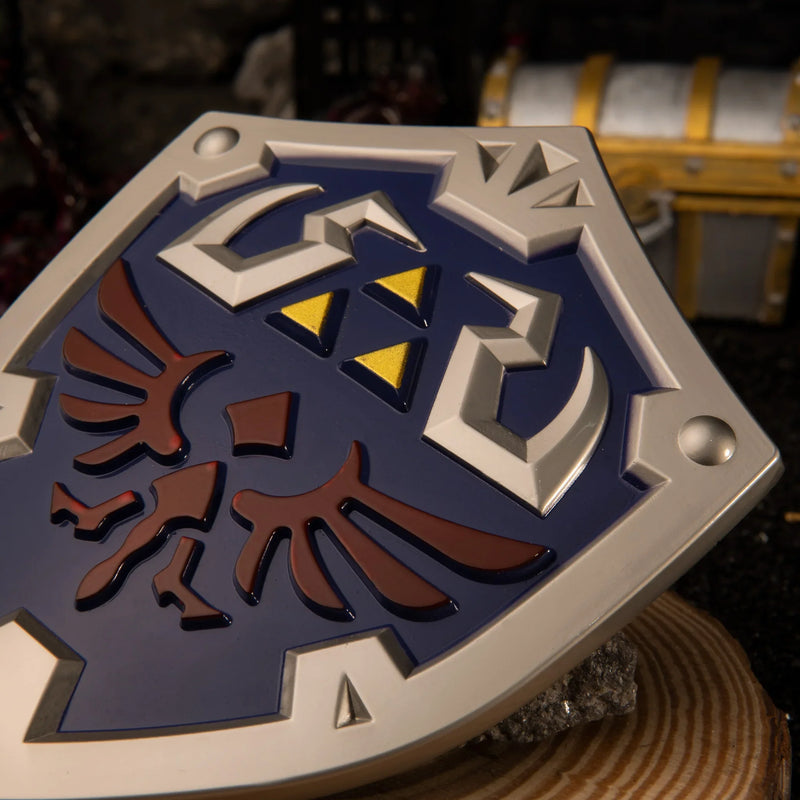 Hylian Shield replica — raised crest and wing emblem close-up.