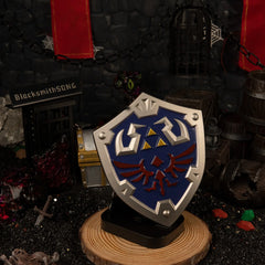 Hylian Shield replica — displayed on the vertical stand.