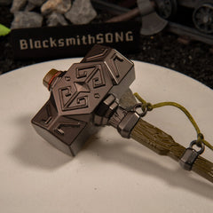 Iron Sledgehammer replica — carved diamond-facet hammer head close-up.