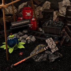 Iron Sledgehammer replica (17.5cm die-cast zinc alloy hammer) — resting on rubble in a handcrafted mine-shaft diorama, by BlacksmithSONG.