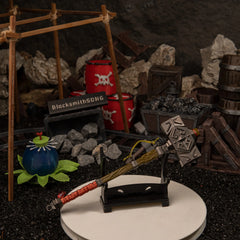 Iron Sledgehammer replica — displayed on the small stand.