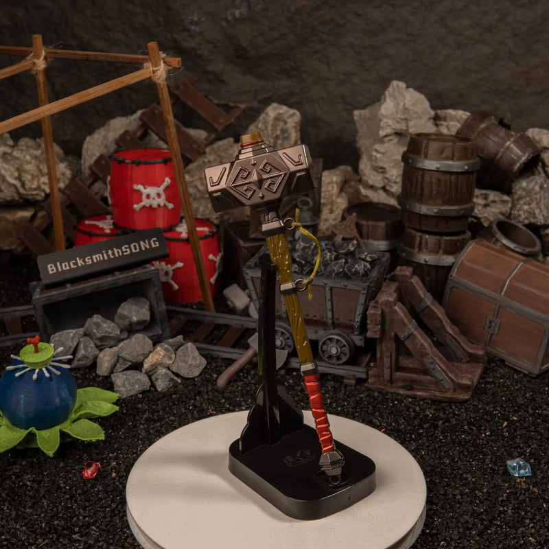 Iron Sledgehammer replica — displayed upright on the vertical stand.