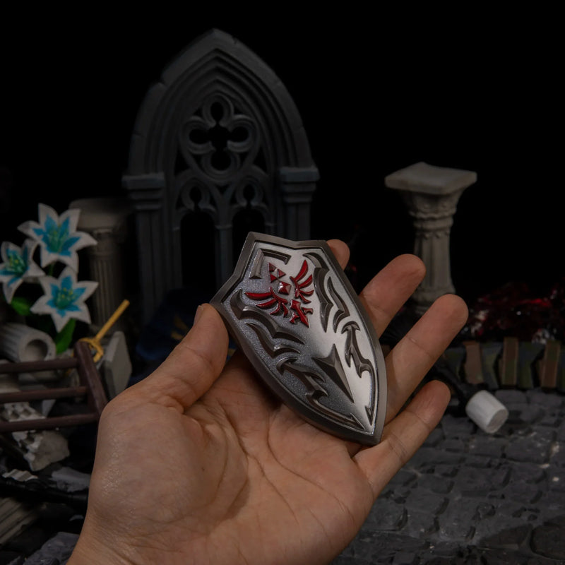 Royal Guard's Shield replica (10cm die-cast zinc alloy shield) — held in hand for scale.