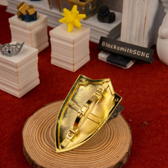 Royal Shield replica — plain metal back and grip structure, close-up.
