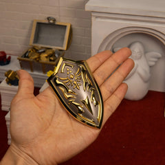 Royal Shield replica (9.5cm die-cast zinc alloy shield) — held in hand for scale.