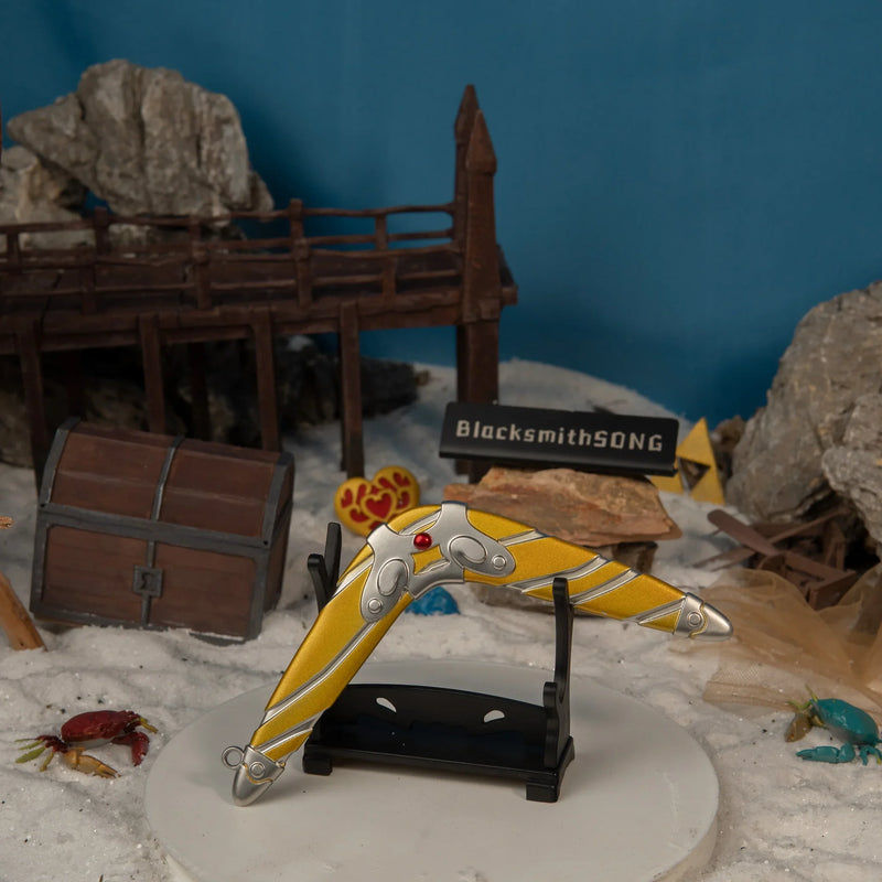 Sea-Breeze Boomerang replica — displayed on the small stand amid beach scenery.