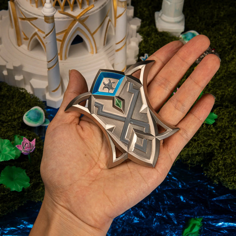 Silver Shield replica (9cm die-cast zinc alloy shield) — held in hand for scale.