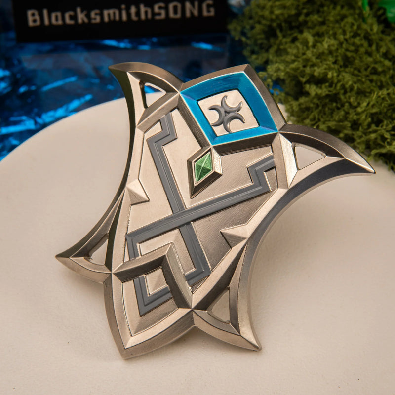 Silver Shield replica — geometric maze pattern and emerald inset close-up.