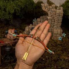 Traveler's Bow replica (17.5cm die-cast zinc alloy bow) — held in hand for scale.