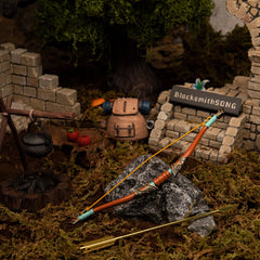 Traveler's Bow replica (17.5cm die-cast zinc alloy bow) — hero shot in a handcrafted travelers' camp diorama, by BlacksmithSONG.