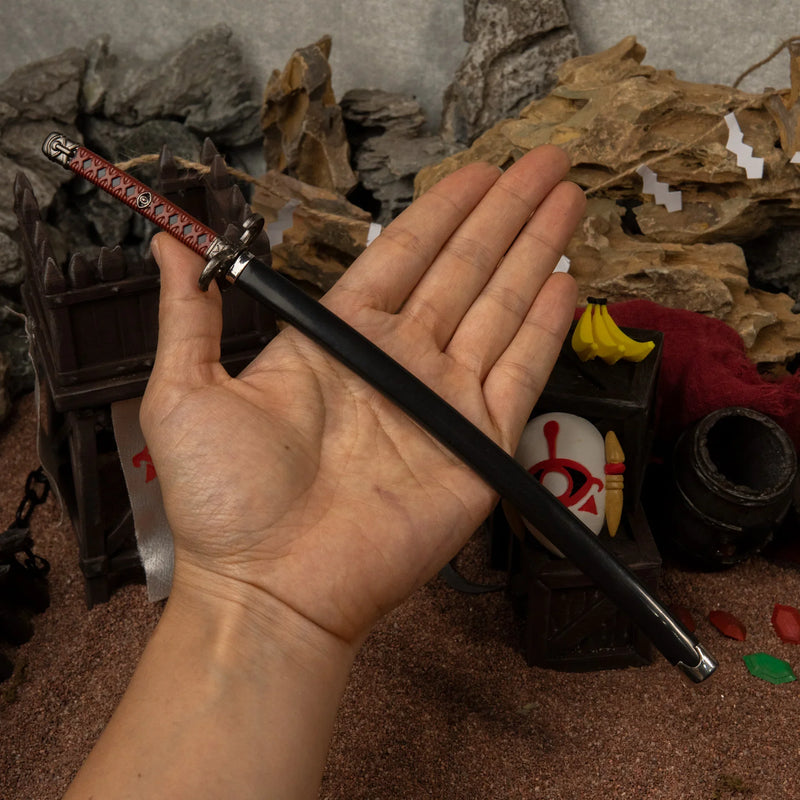 Windcleaver replica (26cm die-cast zinc alloy sword) — held in hand for scale.