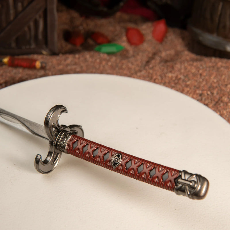Windcleaver replica — hooked hilt and wave-patterned blade close-up.