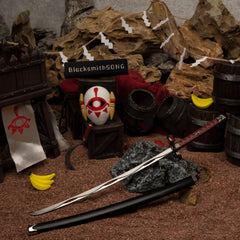 Windcleaver replica (26cm die-cast zinc alloy sword) — resting in the desert hideout diorama, by BlacksmithSONG.